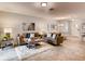 Open concept living room and dining area with tile floors and neutral decor at 6102 Galloping Dr, Apopka, FL 32712