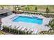 Community pool with plenty of lounge chairs at 6102 Galloping Dr, Apopka, FL 32712