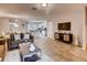 Open-concept living room with kitchen view and stylish decor at 6106 Galloping Dr, Apopka, FL 32712