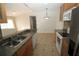 Kitchen with granite countertops and stainless steel appliances at 825 Grand Regency Pointe # 200, Altamonte Springs, FL 32714