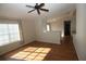Bright living room featuring hardwood floors and a ceiling fan at 825 Grand Regency Pointe # 200, Altamonte Springs, FL 32714