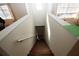 Indoor view of wooden stairs leading to the lower level at 825 Grand Regency Pointe # 200, Altamonte Springs, FL 32714