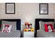 Mickey Mouse themed bedroom with twin beds and playful decor at 8933 Amelia Downs Trl, Kissimmee, FL 34747