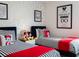 Mickey Mouse themed bedroom with twin beds and inspirational art at 8933 Amelia Downs Trl, Kissimmee, FL 34747