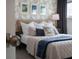 Bedroom with geometric wallpaper and a comfy bed at 8933 Amelia Downs Trl, Kissimmee, FL 34747