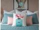 Bedroom featuring Chanel-inspired decor and a teal comforter at 8933 Amelia Downs Trl, Kissimmee, FL 34747
