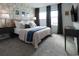 Spacious bedroom with stylish decor and large windows at 8933 Amelia Downs Trl, Kissimmee, FL 34747