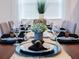 Elegant dining room, table set for dinner party at 8933 Amelia Downs Trl, Kissimmee, FL 34747