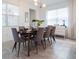 Bright dining room with mid-century modern dining set at 8933 Amelia Downs Trl, Kissimmee, FL 34747