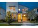 Two-story modern home with stone accents and a two-car garage at 8933 Amelia Downs Trl, Kissimmee, FL 34747