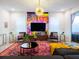 Bright living room with bold art, comfy seating, and stylish decor at 8933 Amelia Downs Trl, Kissimmee, FL 34747
