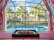 Enjoy a refreshing snack by the pool with this beautiful view at 8933 Amelia Downs Trl, Kissimmee, FL 34747