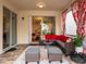 L-shaped sectional and ottomans in a screened-in patio at 8933 Amelia Downs Trl, Kissimmee, FL 34747
