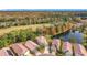 Community view with houses, pond, and golf course at 944 Torrey Pine Dr, Winter Springs, FL 32708
