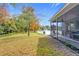 Landscaped backyard with pond view at 944 Torrey Pine Dr, Winter Springs, FL 32708