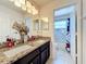 Bathroom with double sinks and granite countertop at 944 Torrey Pine Dr, Winter Springs, FL 32708
