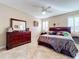 Spacious bedroom with a dresser and a comfortable bed at 944 Torrey Pine Dr, Winter Springs, FL 32708