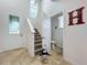 Entryway with tile floor, stairs, and half bathroom at 944 Torrey Pine Dr, Winter Springs, FL 32708