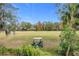 Golf course view with golf cart and lush landscaping at 944 Torrey Pine Dr, Winter Springs, FL 32708