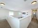 Upstairs hallway with carpet and access to bedrooms at 944 Torrey Pine Dr, Winter Springs, FL 32708