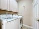 Laundry room with LG washer and dryer, cabinets and a closet at 944 Torrey Pine Dr, Winter Springs, FL 32708