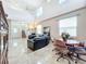 Open living area with high ceilings, leather furniture, and dining area at 944 Torrey Pine Dr, Winter Springs, FL 32708