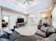Spacious living room with high ceilings and leather couches at 944 Torrey Pine Dr, Winter Springs, FL 32708