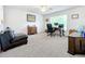 Home office with built-in desk and comfortable seating at 944 Torrey Pine Dr, Winter Springs, FL 32708