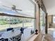 View of a relaxing patio through a large window at 944 Torrey Pine Dr, Winter Springs, FL 32708
