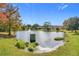 Scenic pond with fountain in a residential area at 944 Torrey Pine Dr, Winter Springs, FL 32708