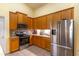 Kitchen features stainless steel appliances and wood cabinets at 10751 Gawsworth Pt, Orlando, FL 32832