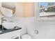 Updated bathroom with modern vanity and toilet at 1217 Magnolia Ave, Sanford, FL 32771