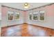 Bright bedroom with hardwood floors and pink walls at 1217 Magnolia Ave, Sanford, FL 32771