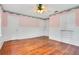 Charming bedroom with hardwood floors, built-in storage, and ceiling fan at 1217 Magnolia Ave, Sanford, FL 32771