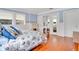 Bedroom with hardwood floors, white metal bed frame, and built-in vanity at 1217 Magnolia Ave, Sanford, FL 32771