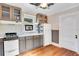 Cozy kitchen featuring wood cabinets and gas stove at 1217 Magnolia Ave, Sanford, FL 32771