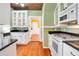 Kitchen with white cabinets, granite counters, and a gas range at 1217 Magnolia Ave, Sanford, FL 32771