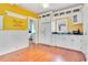 Bright kitchen with white cabinets, granite counters, and hardwood floors at 1217 Magnolia Ave, Sanford, FL 32771