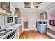 Quaint kitchen with wood cabinets and gas range at 1217 Magnolia Ave, Sanford, FL 32771