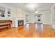 Hardwood floors, fireplace, and French doors in the living room at 1217 Magnolia Ave, Sanford, FL 32771