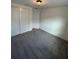 Empty bedroom with gray carpeting and double doors leading to a closet at 13007 Bromborough Dr, Orlando, FL 32832