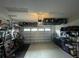 Garage interior with overhead storage and bikes at 13007 Bromborough Dr, Orlando, FL 32832