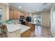 Kitchen boasting light wood cabinets, black appliances, and an island at 14727 Clarkson Dr, Orlando, FL 32828