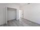 Empty bedroom with grey flooring and a closet at 14949 Sw 65Th Avenue Rd, Ocala, FL 34473