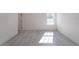 Spacious bedroom featuring wood-look floors and a window at 14949 Sw 65Th Avenue Rd, Ocala, FL 34473