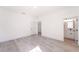 Light and airy bedroom with wood-look floors and ensuite bathroom at 14949 Sw 65Th Avenue Rd, Ocala, FL 34473