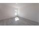 Bright bedroom with wood-look floors and large window at 14949 Sw 65Th Avenue Rd, Ocala, FL 34473