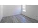 Bedroom with grey flooring and a window at 14949 Sw 65Th Avenue Rd, Ocala, FL 34473