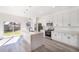 Modern kitchen with white cabinets, quartz countertops, and island at 14949 Sw 65Th Avenue Rd, Ocala, FL 34473