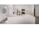 White kitchen with large island and stainless steel appliances at 14949 Sw 65Th Avenue Rd, Ocala, FL 34473